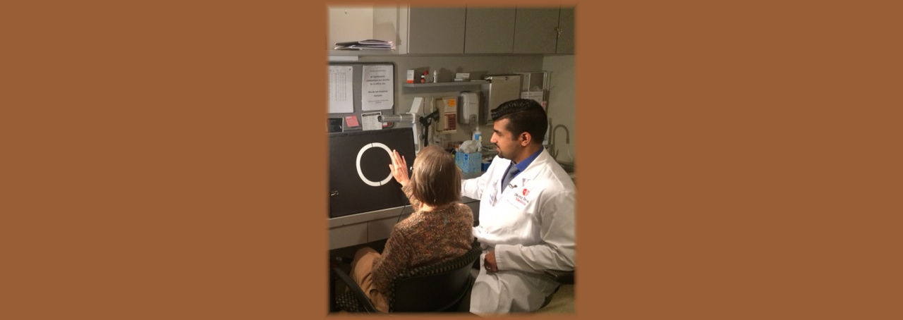 Dr. Khurram Chaudhary, a retinal surgeon at Stony Brook Medicine with patient Linda Kirk
