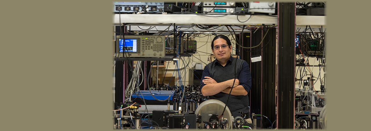 Associate professor of physics at Stony Brook University, Eden Figueroa in his lab