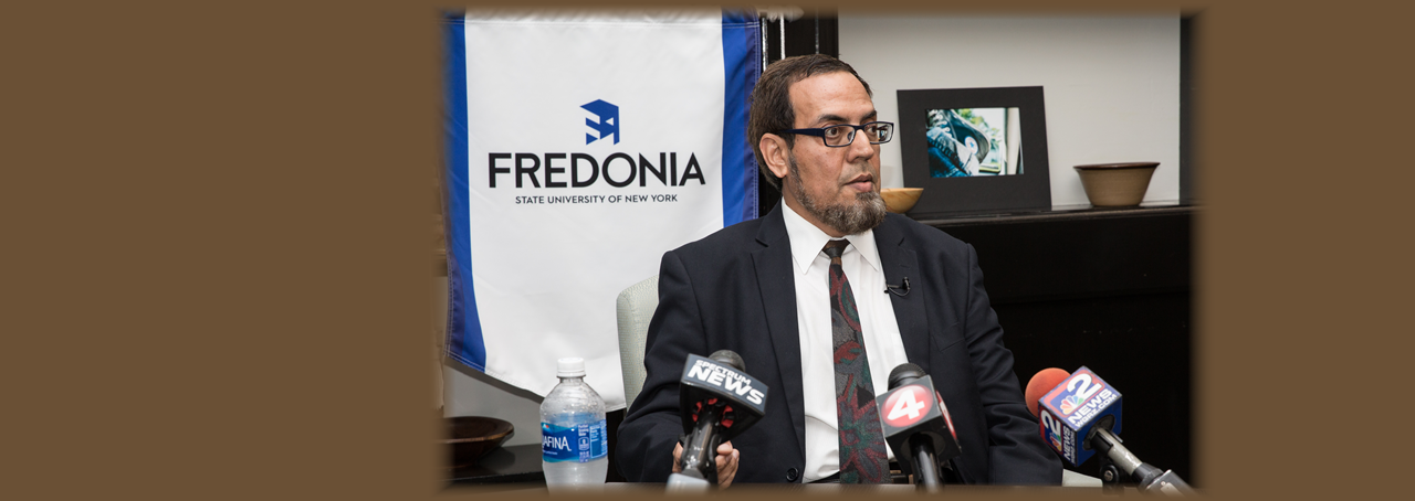Dr. Junaid Zubairi of SUNY Fredonia at a press conference