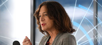 Stony Brook University President Andrea Goldsmith speaking at the 'First Light’ event August 21 at Brookhaven National Laboratory