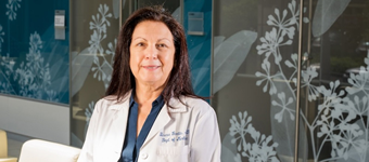 Upstate Medical University cancer specialist Dr. Teresa Gentile in lab coat