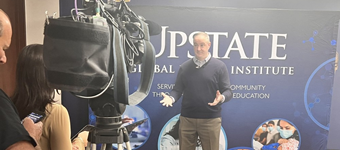 Stephen Thomas, MD, director or Upstate Global Health Institute, talks to reporters about Upstate’s clinical trial of a possible C. diff vaccine.  It is Upstate’s largest clinical trial