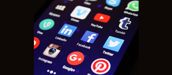 A cell phone screen displaying different social media applications