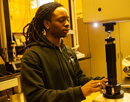 Malcolm John, a mechanical engineering senior at Binghamton University working in the lab