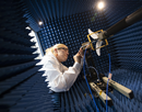 Casey Baumlin conducts electrical testing in Distinguished Professor Mark Poliks' lab at Binghamton University's Innovative Technologies Complex
