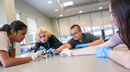 Prisha Patel, 12, left, and 14-year-olds Myka Batterson, Maxwell Riley, and Ella Blazey conduct an experiment in which they control ferrofluid, a unique liquid that reacts strongly to magnets as they participated in a weeklong microelectronics camp held in July at Binghamton University.