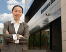 Assistant Professor Yingxue Zhang in front of Binghamton University’s Thomas J Watson College of Engineering and Applied Science