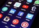 A cell phone screen displaying different social media applications