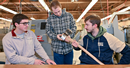Nathan St. Louis, Matthew Gattus, and Mitch Timerman hold their finished axe