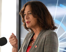 Stony Brook University President Andrea Goldsmith speaking at the ‘First Light’ event August 21 at Brookhaven National Laboratory