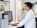 Lokesh Padhye, at work in his lab at Stony Brook University