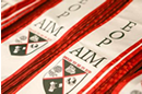 cream sashes with red borders with the EOP/AIM words and logo