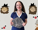 Julia Zottola ’26 holds a fossil. The background is from a Spanish-language YouTube video that she and classmate Sofia Corsico-Sánchez ’26 created on the Permian Period. Image Credit: Composite photo