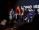 Acting CEO of Long Island Association Stacey Sikes moderating a panel featuring Stony Brook University president Andrea Goldsmith alongside New York Institute of Technology President and CEO Jerry Balentine at the Long Island Tech and Innovation Summit