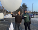 UAlbany students Chris Gilberti (left) and Evan Belkin prepare to launch a weather balloon from ETEC as part of a NASA field campaign
