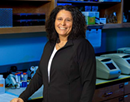 University at Buffalo associate professor Rose-Anne Romano in her lab