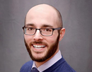 Headshot of University at Albany’s clinical associate professor Jake McPherson