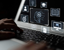 Concept of AI in Education featuring hands using a laptop and and overlay of AI graphics