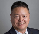 Distinguished professor Siwei Lyu in a dark suit and tie with grey background