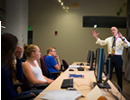 The annual summer workshop began in 1999, and it has introduced hundreds of students to computational science. Standing on the right is E. Bruce Pitman, the workshop’s director