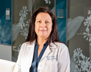 Upstate Medical University cancer specialist Dr. Teresa Gentile in lab coat