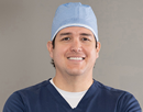 Upstate cardiologist Dr. Jorge E. Romero in scrubs
